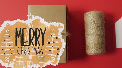 animation of merry christmas text over present on red background
