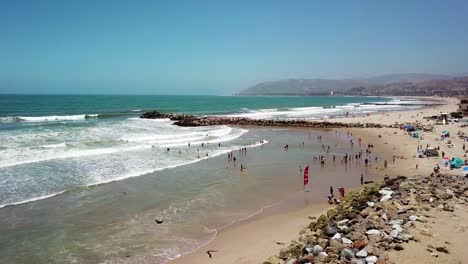 Aerial-over-a-southern-california-beach-scene-during-summertime