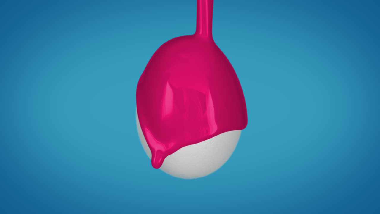 이스터 달은 염료를 뿌려서 분홍색으로 칠했습니다. 느린 동작, 파란색 배경