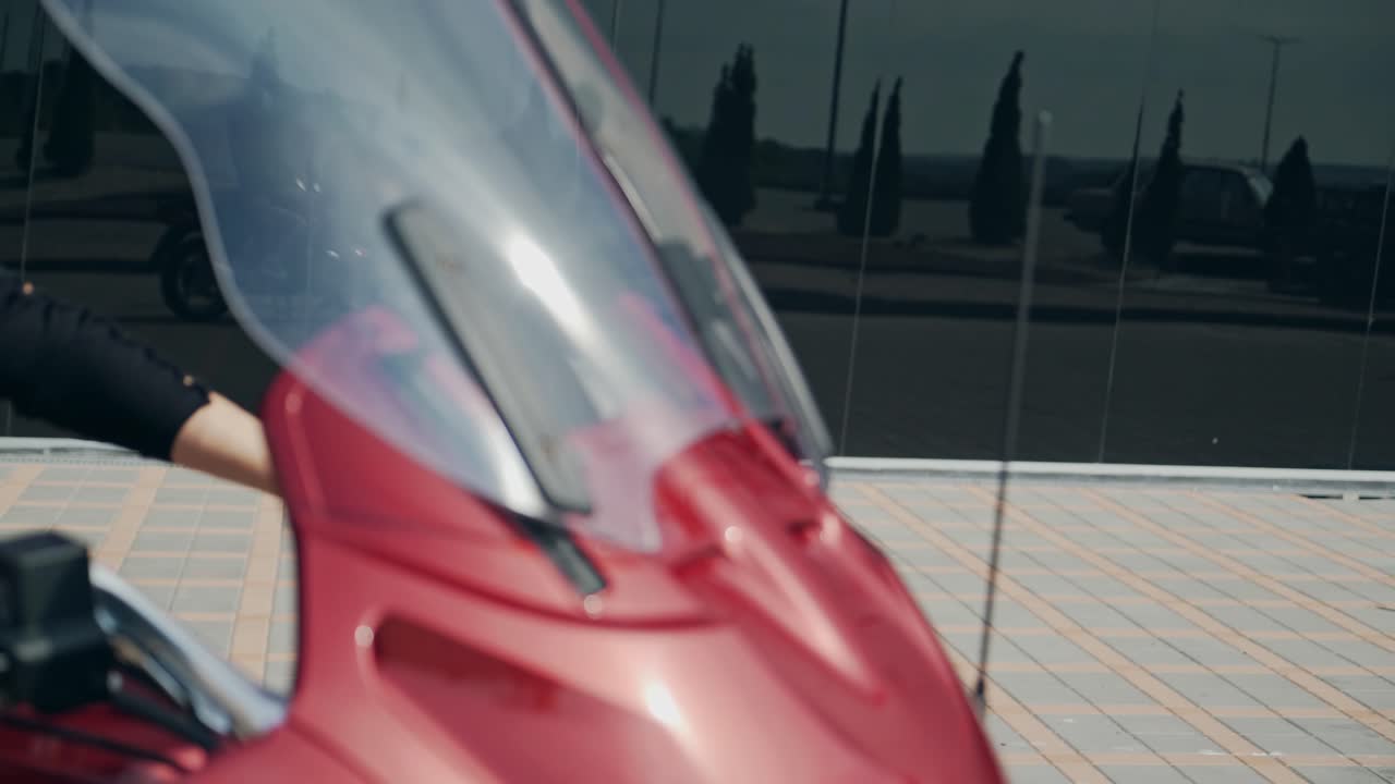 Female biker on motorbike. Young pretty woman sitting on motorbike