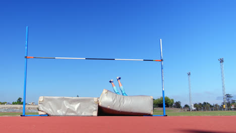 caucasian female athlete practicing high jump at sports venue 4k