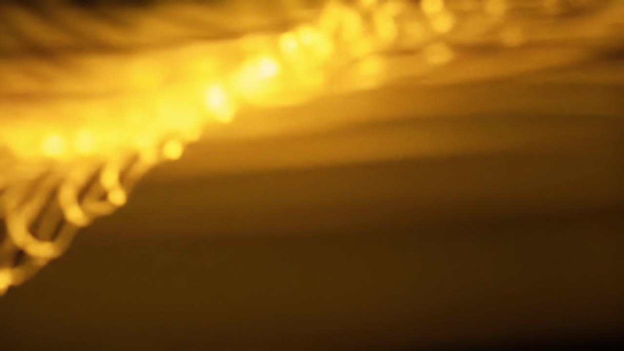 Glowing golden lights dance in a dark urban environment, enhancing the lively atmosphere. The scene showcases an energy pulsating through the night, inviting viewers into the experience.