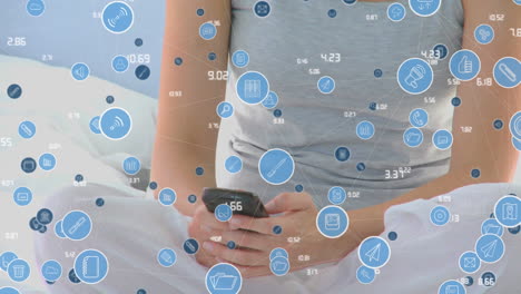 animation of network of connections with icons over woman using smartphone