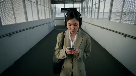 woman walking in an urban overpass