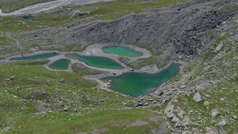 emerald water of mountain lake in summer season in valmalenco of valtellina in northern italy