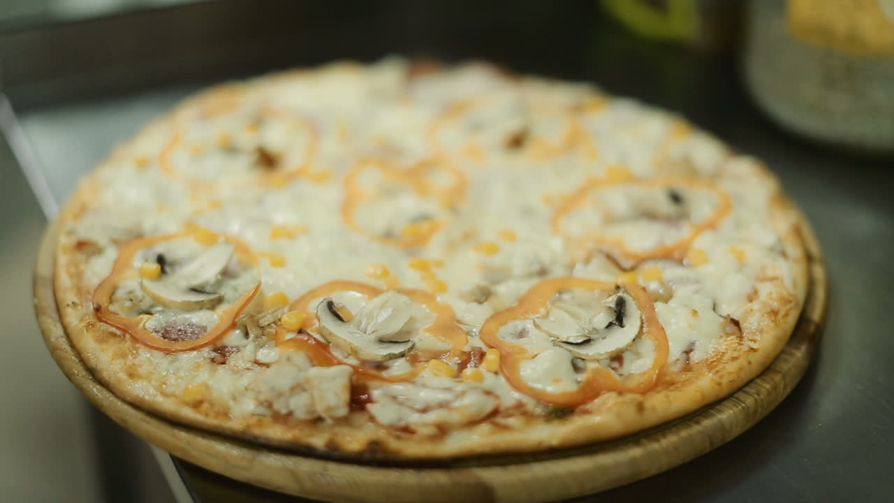 Italian Pizza With Ingredients. Fresh baked pizza with mushrooms and peppers