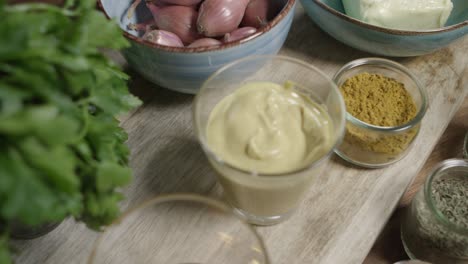 top view dolly shot of lined up ingredients for the legendary café-de-paris sauce