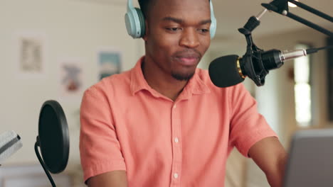 Black-man,-laptop-or-radio-microphone-for-podcast