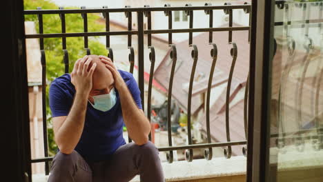 Depressed-man-with-disposable-mask