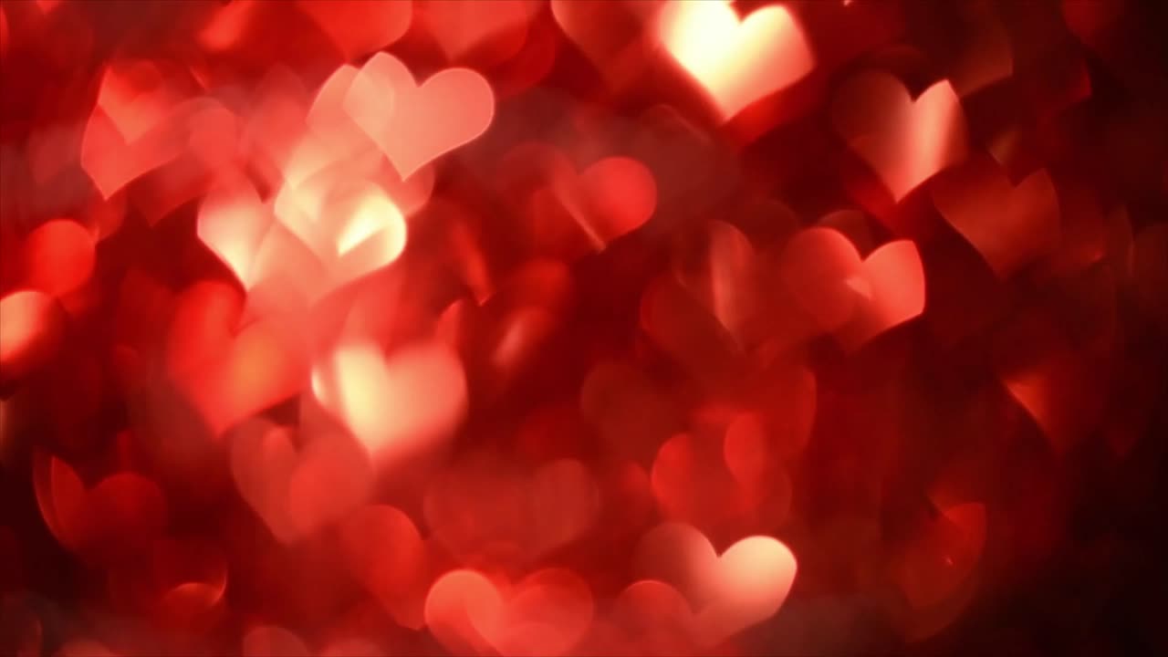 Sfondo di luci bokeh a forma di cuore rosso scintillante