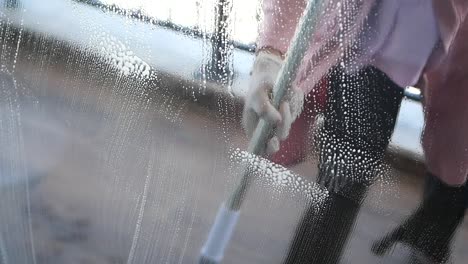 a woman cleaning a window