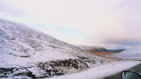 View-From-Outside-Car-Driving-In-Snow-Covered-Road