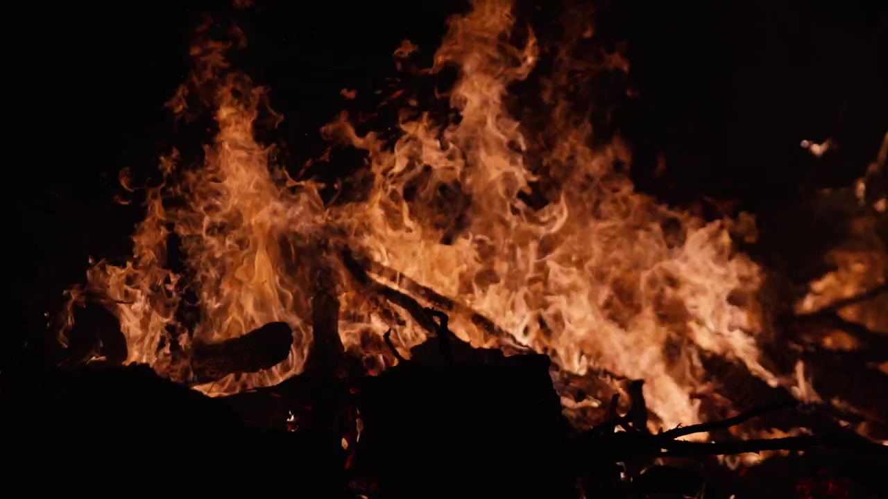Intense Flames of a Bonfire Burning in the Dark