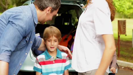 Parents-speaking-then-posing-with-children-in-the-park