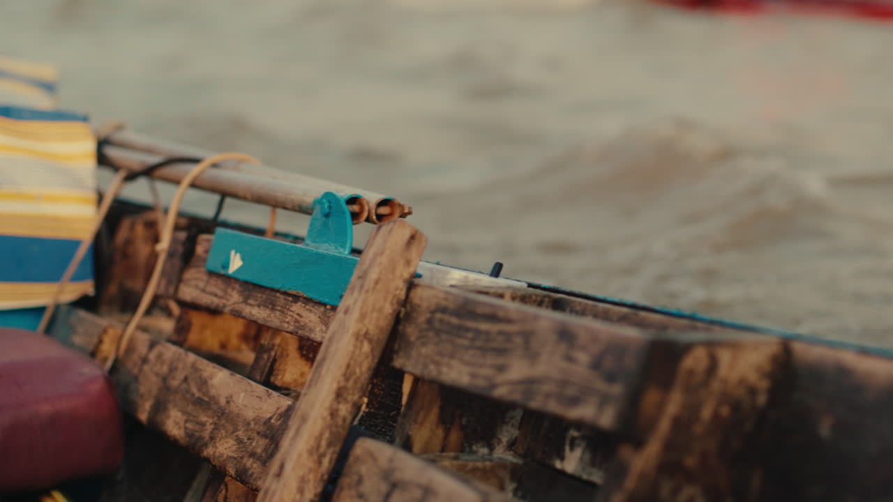 Wooden Boat on a River with People