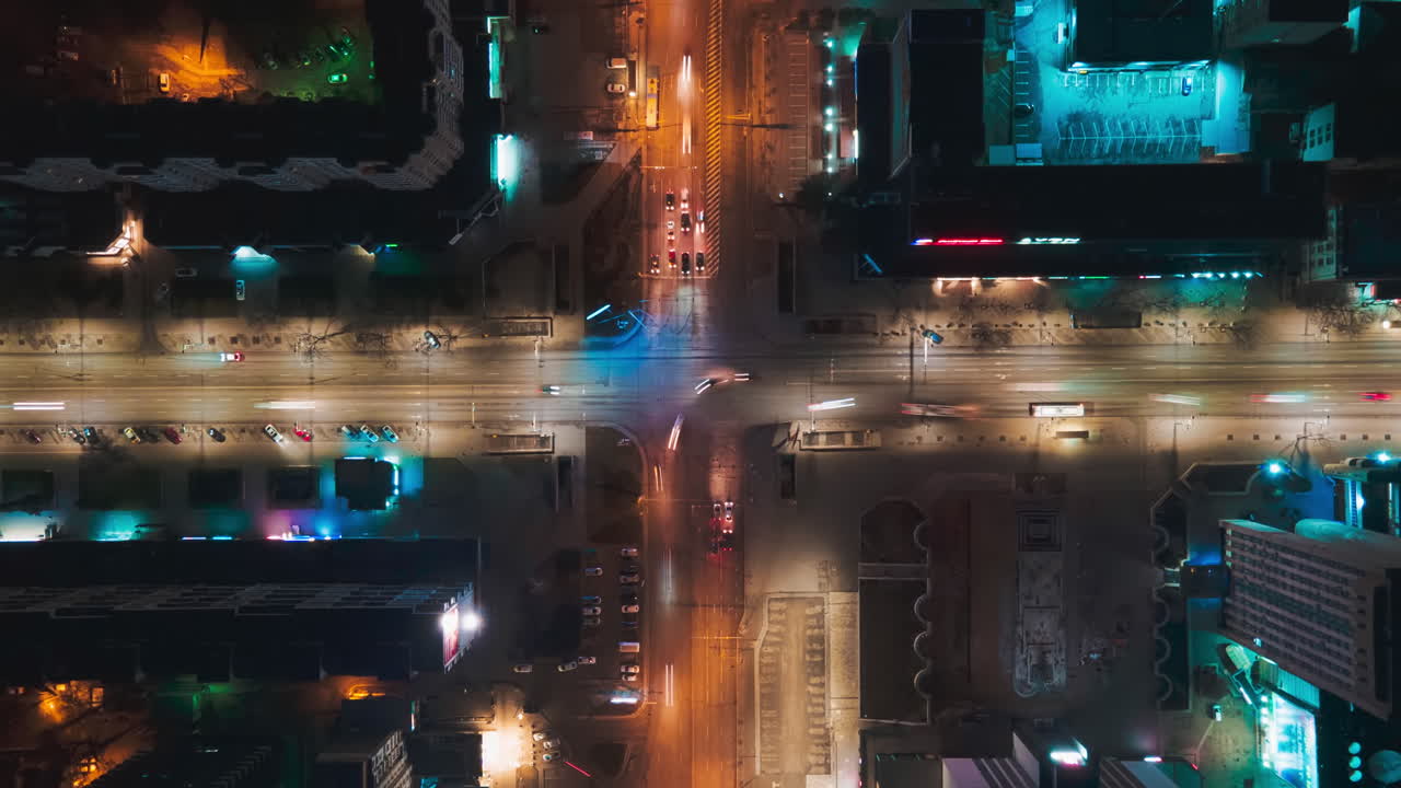 Aerial drone hyperlapse timelapse of moving cars in the city at night. Busy intersection. Top down viewChisinau, Moldova