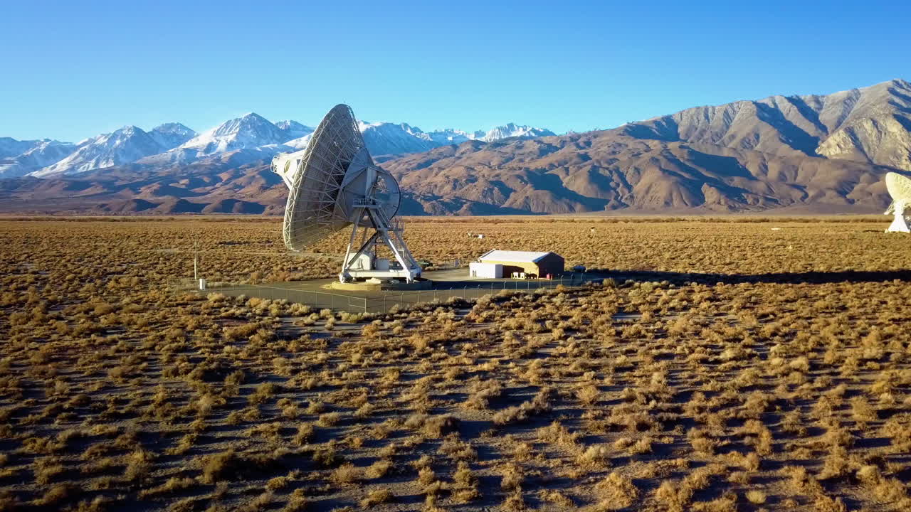 Aerial view around a big Radar Array, at a desert in USA - circling, drone shot