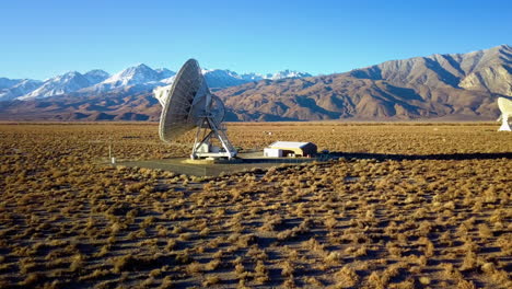aerial view around a big radar array, at a desert in usa - circling, drone shot
