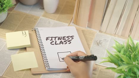 ticking off fitness class from checklist