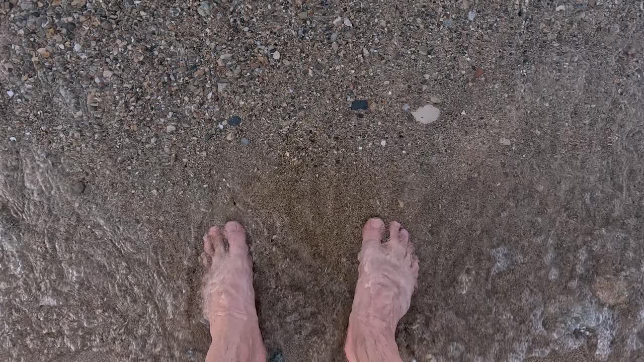 As gentle waves caress bare feet, the warm sun shines down on a serene beach. The sound of the ocean creates a peaceful atmosphere perfect for relaxation