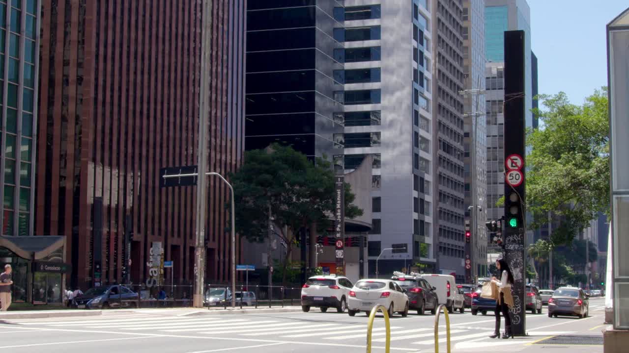 Streetlights blink, chaos thrives, city life, where everyone strives