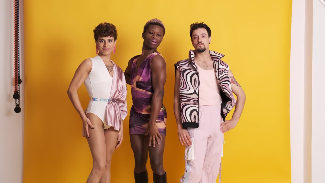 Multiethnic trans men posing in a sensual way while looking at camera