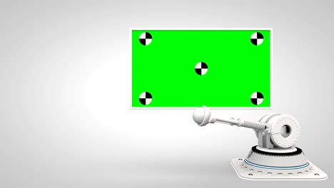 white robotic arm hold and moving green screen