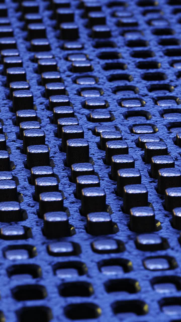 Blue background of black graphite cubes. Vertical looped video