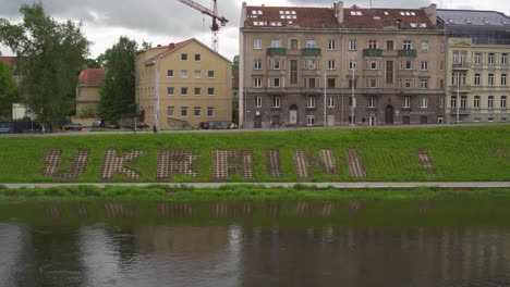 vilnius, lithuania – 29 may 2022. glory to ukraine sign on the riverside