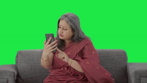 Indian-old-woman-talking-on-video-call-Green-screen