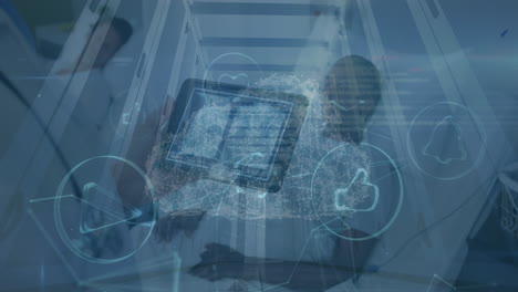 animation of digital cloud and icons over caucasian male doctor with tablet