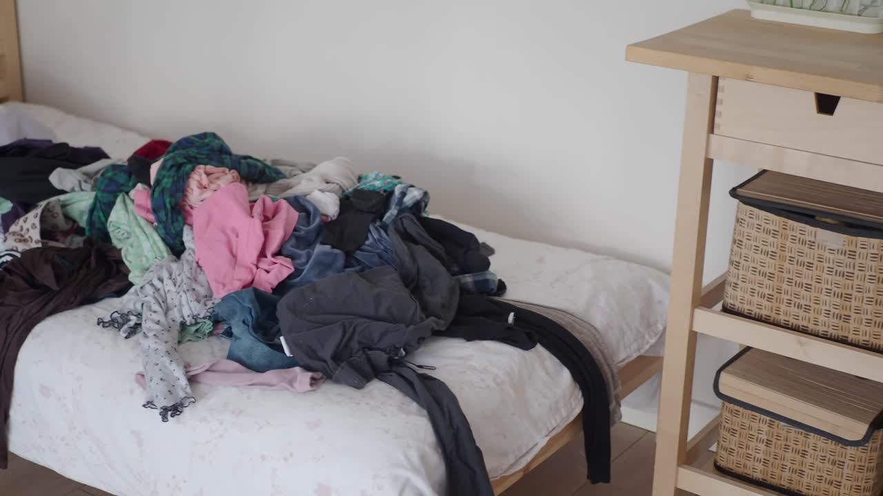 Messy bed with clothing