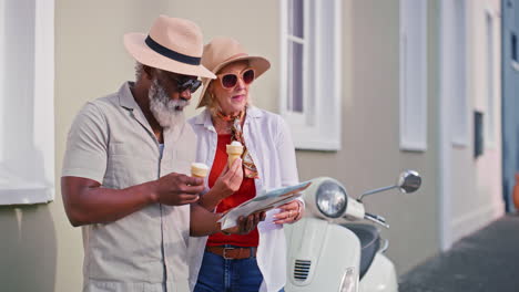 senior couple enjoying ice cream and exploring the city with a map