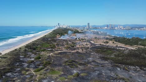 popular holiday nature reserve destroyed by fire close to a city beach and boating harbour