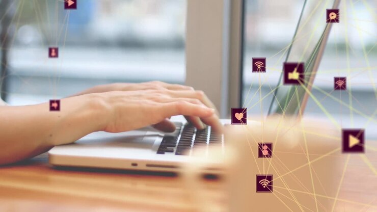 Animation of two globes of digital icons spinning over mid section of woman using laptop at a cafe