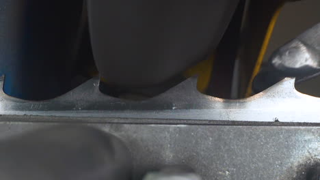 handle-of-mechanism-moves-band-saw-teeth-to-sharpener-macro