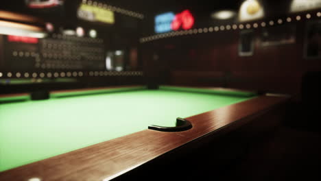 pool table in a dimly lit bar at night