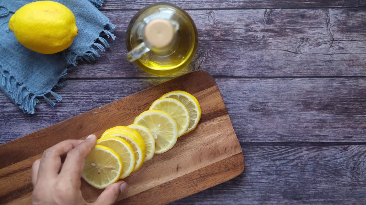 Sliced Lemons on a Wooden Cutting Board