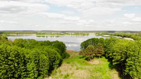 picturesque lake surrounded by lush vegetation near styporc village in chojnice county, northern poland