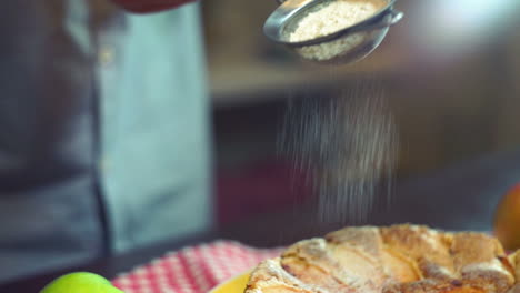 Sprinkling-powdered-sugar-in-slow-motion.-Cake-decoration