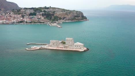 greek scenic view of a prision tower in the ocean, bourtzi