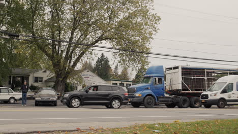 clarence, ny, usa, october 2021: cars bypass the break in the power supply cable, volunteers regulate traffic