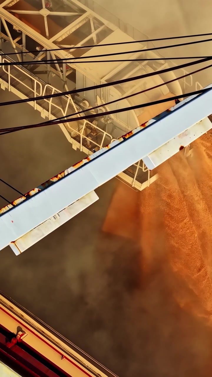 Vertical shot mineral ore being processed on industrial conveyor belt