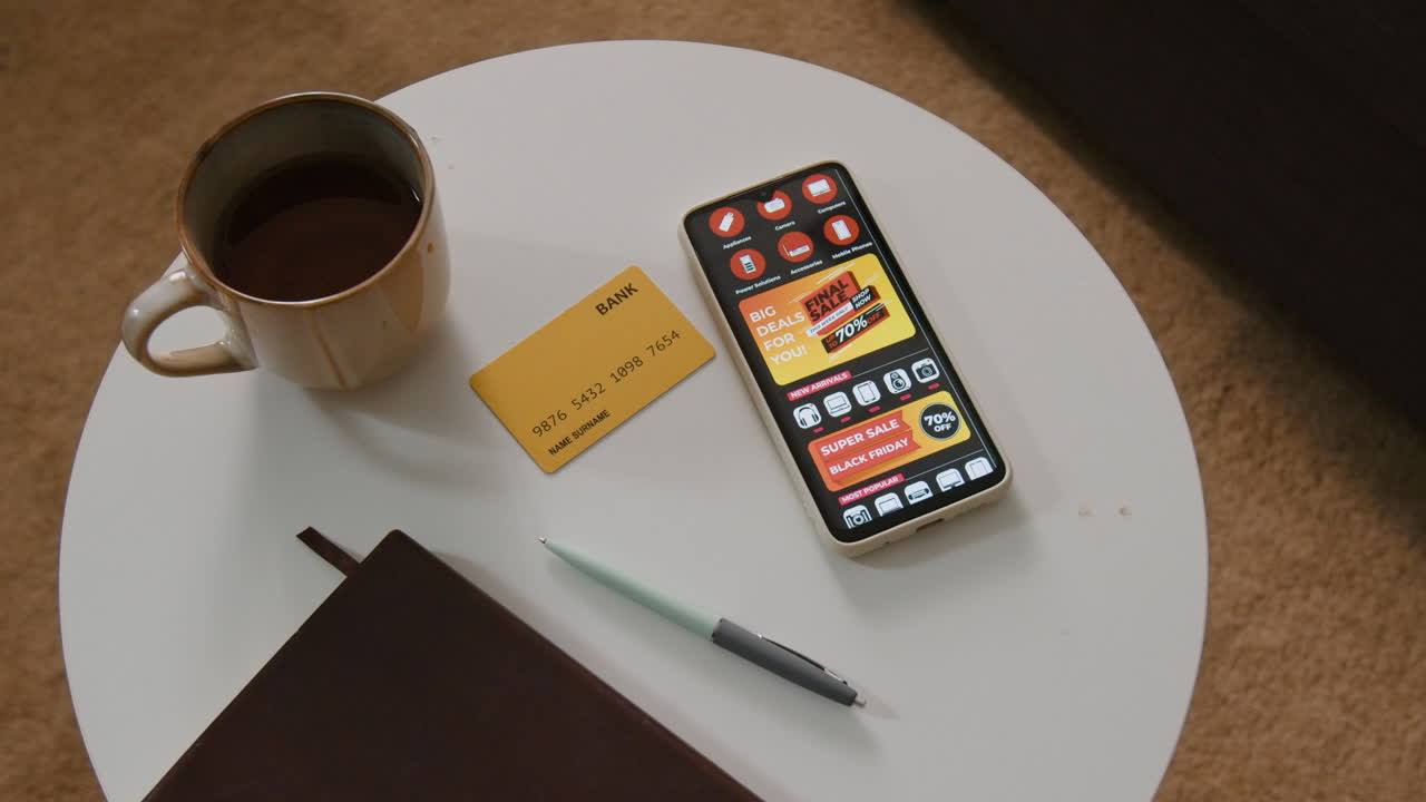 Coffee, Credit Card, and Cell Phone with Black Friday Sale