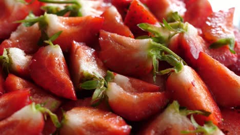 strawberry strawberries sliced into quarters turn turning round rotating