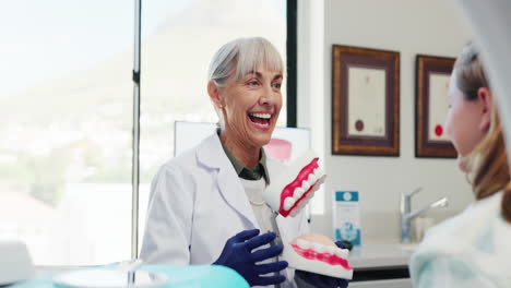 dentist explaining dental hygiene to patient