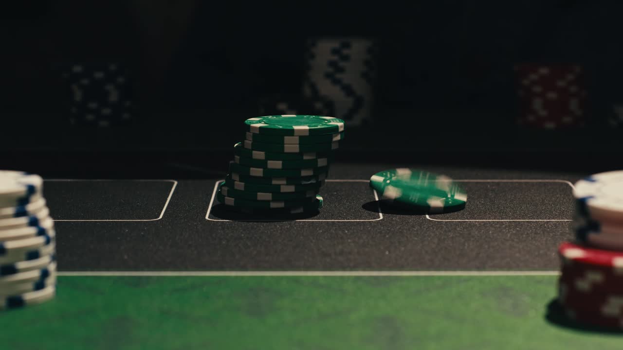 Hands managing poker chips on green table, reflecting intense poker gameplay with the element of chance and skill