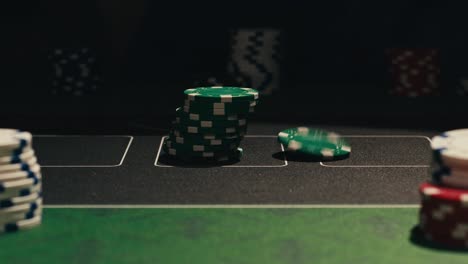 hands managing poker chips on green table, reflecting intense poker gameplay with the element of chance and skill
