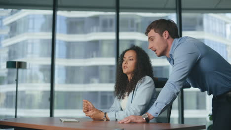 Closeup-business-couple-exploring-metaverse.-Colleagues-discussing-project