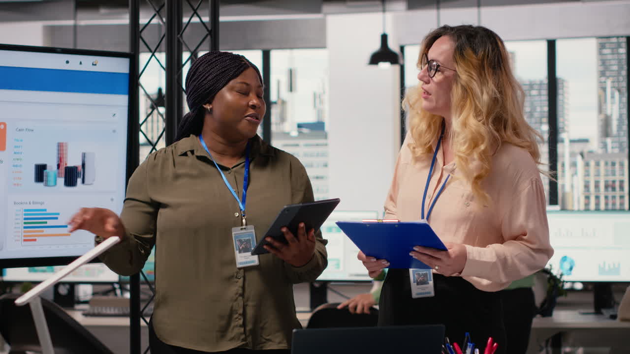 Vertical Video Businesswomen in corporate setting show empowerment through action